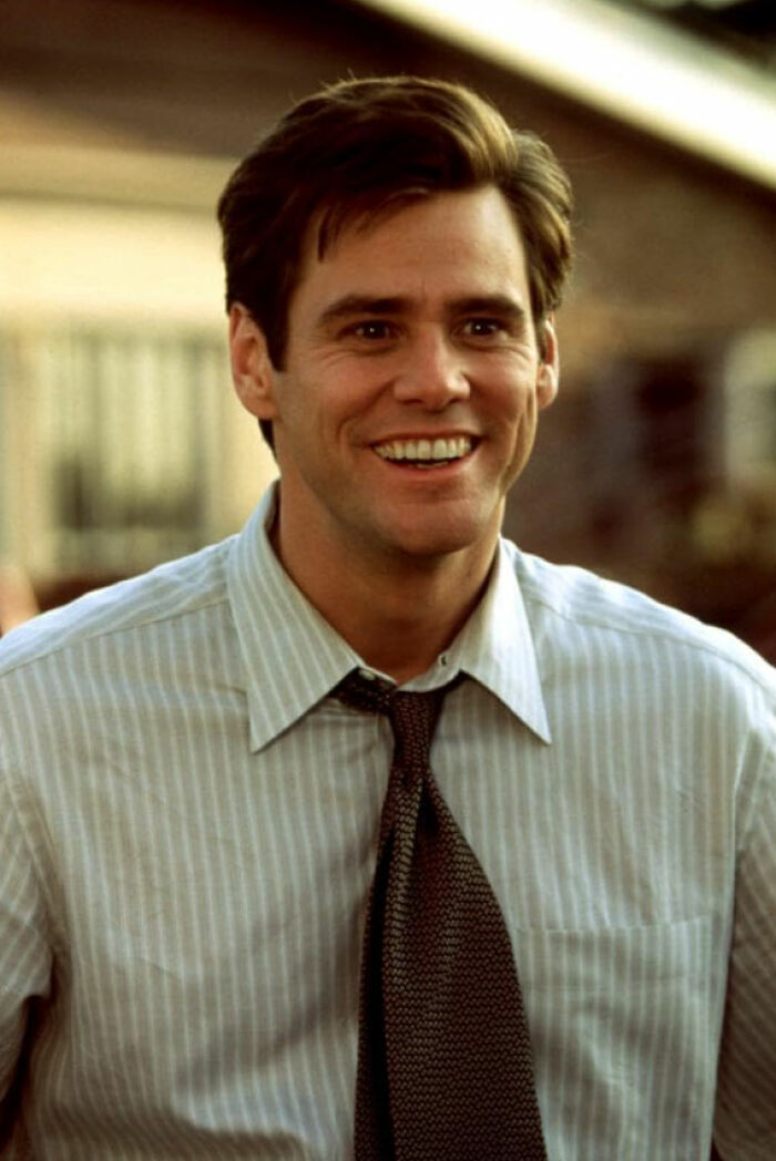 Smiling male movie star on set in shirt and tie, illustrating biggest diva stars shared by movie set workers.