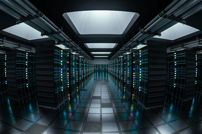 Modern data center with rows of servers and blinking lights illustrating pressing issues plaguing America’s technology infrastructure.