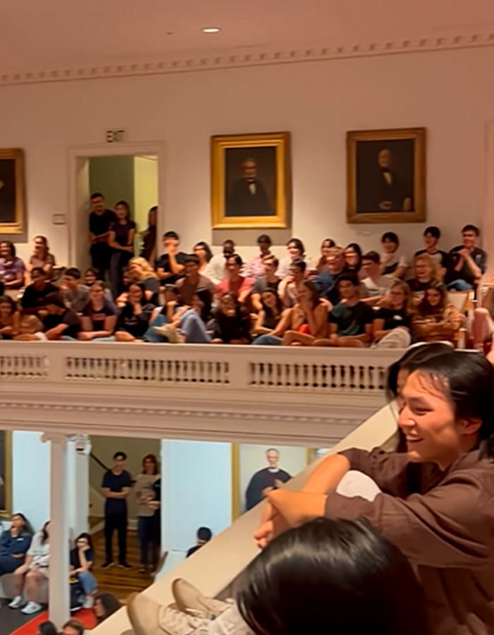 Students gathered in a crowded Amherst College hall during a controversial orientation event sparking backlash and administrative firings. Students gathered in a crowded Amherst College hall during a controversial orientation event sparking backlash and administrative firings.