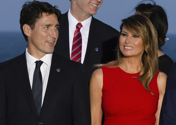 Two people dressed formally at an event, with expressions highlighting Barron Trump awkward moment and paternity theories. Two people dressed formally at an event, with expressions highlighting Barron Trump awkward moment and paternity theories.