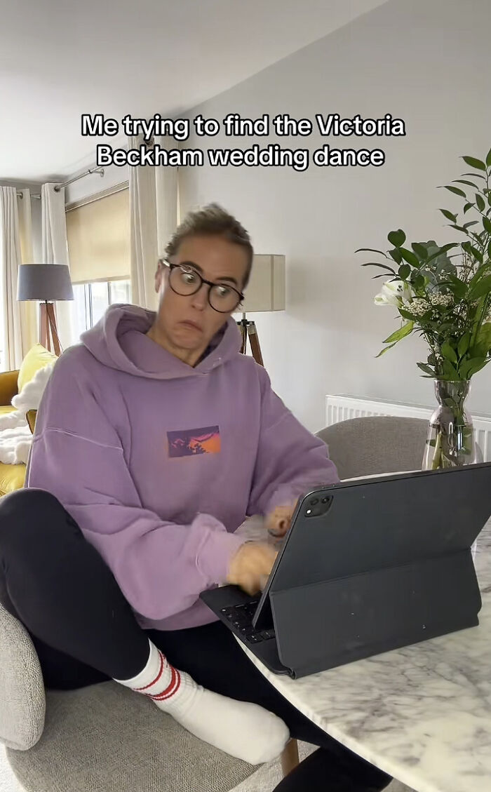 Person in glasses and purple hoodie urgently typing on tablet, meme about Victoria Beckham wedding dance search.