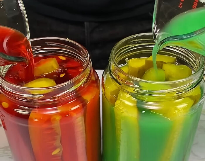 Two jars filled with colorful pickled vegetables and vibrant liquids, highlighting unusual local delicacies and exotic foods.