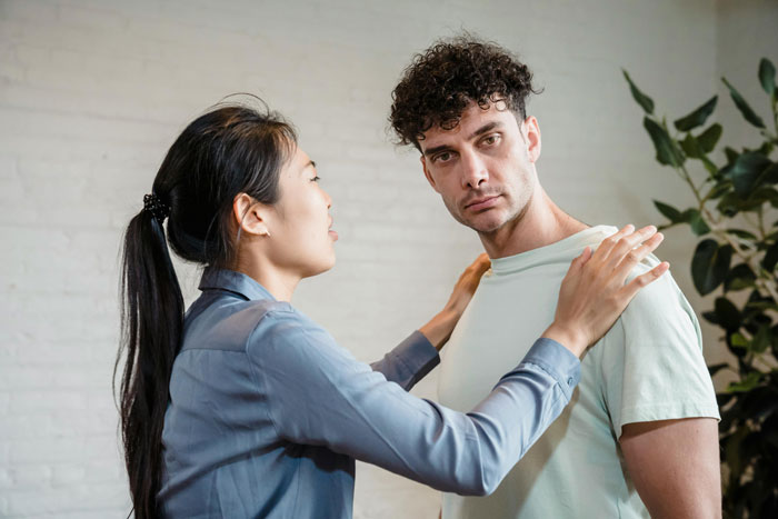Woman feels like a guest in her own home, discussing relationship issues with boyfriend in a tense moment indoors.
