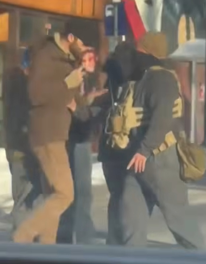Group of people outside in daylight, one holding a phone, related to viral clips of Alex Pretti before fatal encounter. Group of people outside in daylight, one holding a phone, related to viral clips of Alex Pretti before fatal encounter.