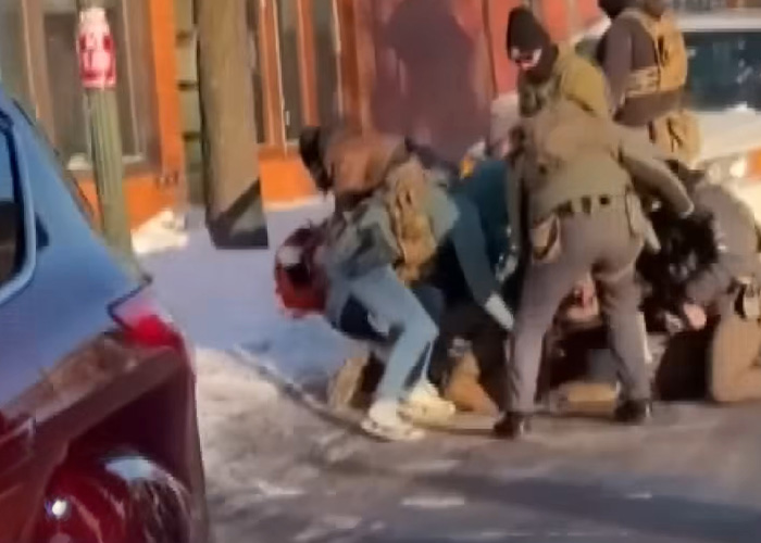 Police officers restraining a man on a snowy street, linked to viral clips of Alex Pretti before fatal encounter. Police officers restraining a man on a snowy street, linked to viral clips of Alex Pretti before fatal encounter.