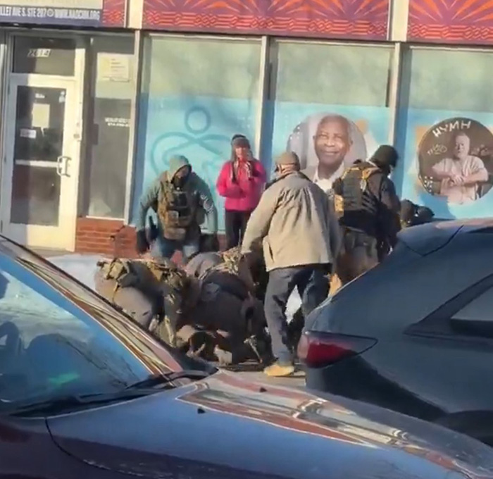 Group of people detaining a man on the ground outside a storefront in viral clips of Alex Pretti before fatal encounter. Group of people detaining a man on the ground outside a storefront in viral clips of Alex Pretti before fatal encounter.