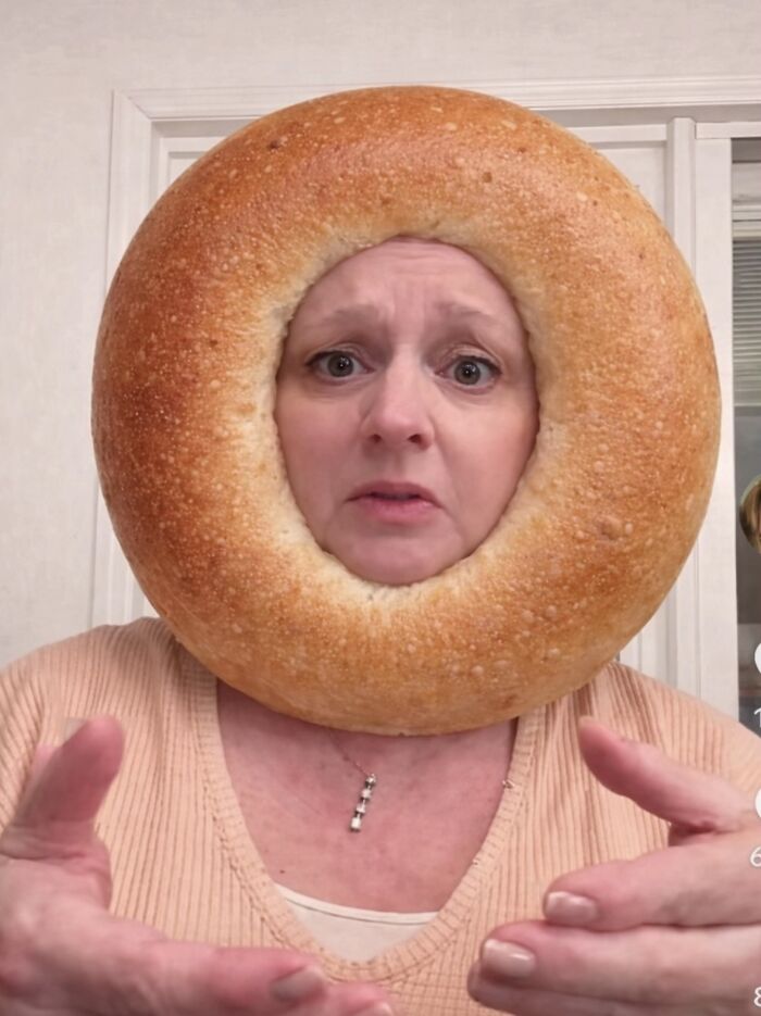 Woman wearing a bagel around her head, sharing a cream cheese review that sparked internet buzz and reactions. Woman wearing a bagel around her head, sharing a cream cheese review that sparked internet buzz and reactions.
