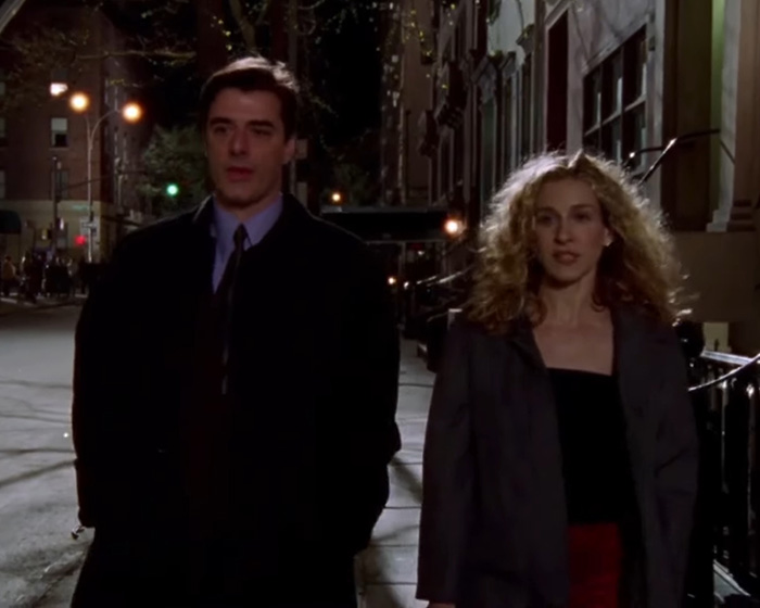 Chris Noth and Sarah Jessica Parker walking on a city street at night in a scene from their acting careers. Chris Noth and Sarah Jessica Parker walking on a city street at night in a scene from their acting careers.