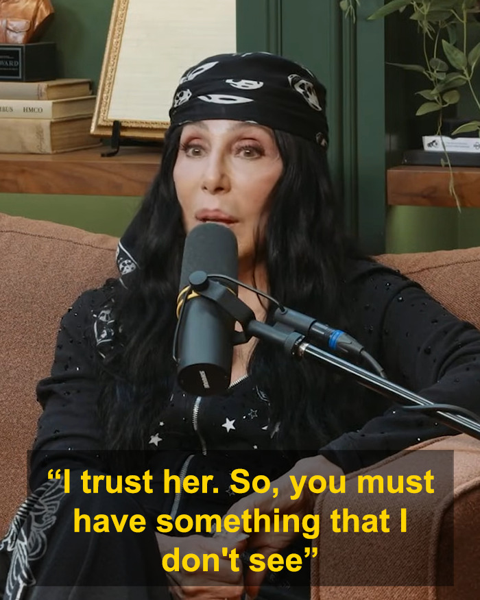 Cher speaking into a microphone on a couch during podcast, Cher comment Kristen Bell Dax Shepard marriage Cher speaking into a microphone on a couch during podcast, Cher comment Kristen Bell Dax Shepard marriage
