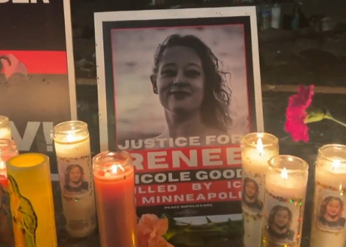 Memorial candles and a photo display calling for justice in the fatal shooting of Ren&eacute;e Nicole Good by ICE.