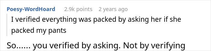 Screenshot of a Reddit comment where a man tries to blame his wife for having no slacks for his business trip.