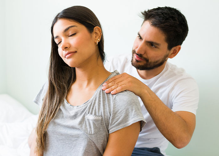 Couple sharing a lighthearted moment together while discussing dumb house rules they now take seriously at home.