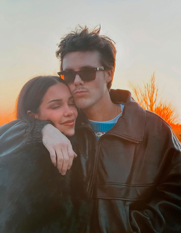 Cruz Beckham with girlfriend dressed in leather jackets during a sunset outing, sparking buzz about her age lookalike.