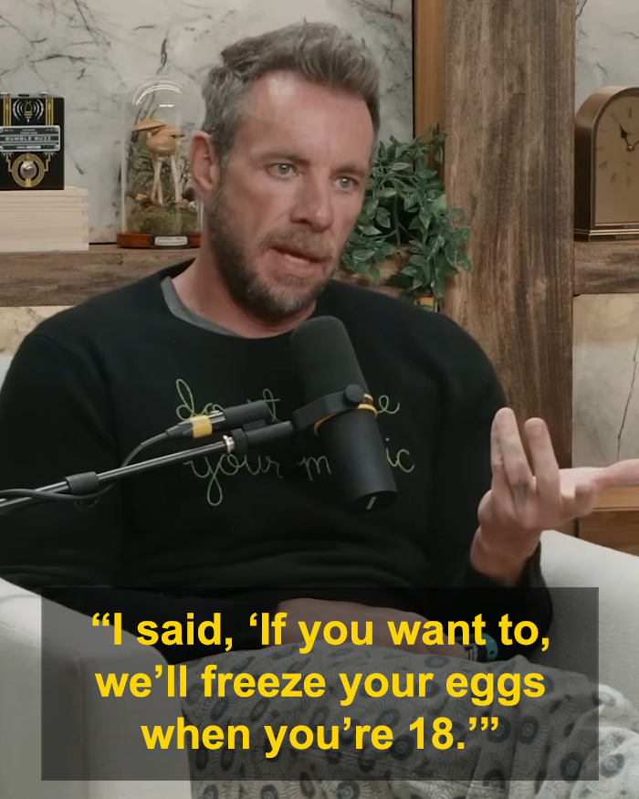 Dax Shepard speaking into a microphone about freezing eggs during a candid conversation in a cozy podcast setting.
