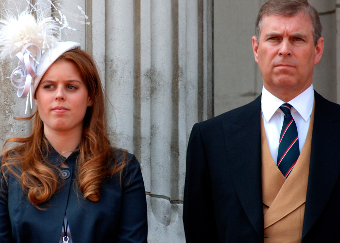 Prince Andrew and a woman standing outdoors in formal attire, linked to disturbing images and emails controversy.