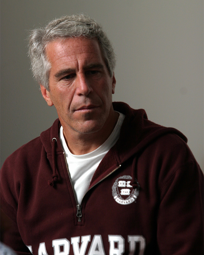 Man in a maroon Harvard sweatshirt looking down, related to DOJ releases new Epstein files about prosecution deals. Man in a maroon Harvard sweatshirt looking down, related to DOJ releases new Epstein files about prosecution deals.