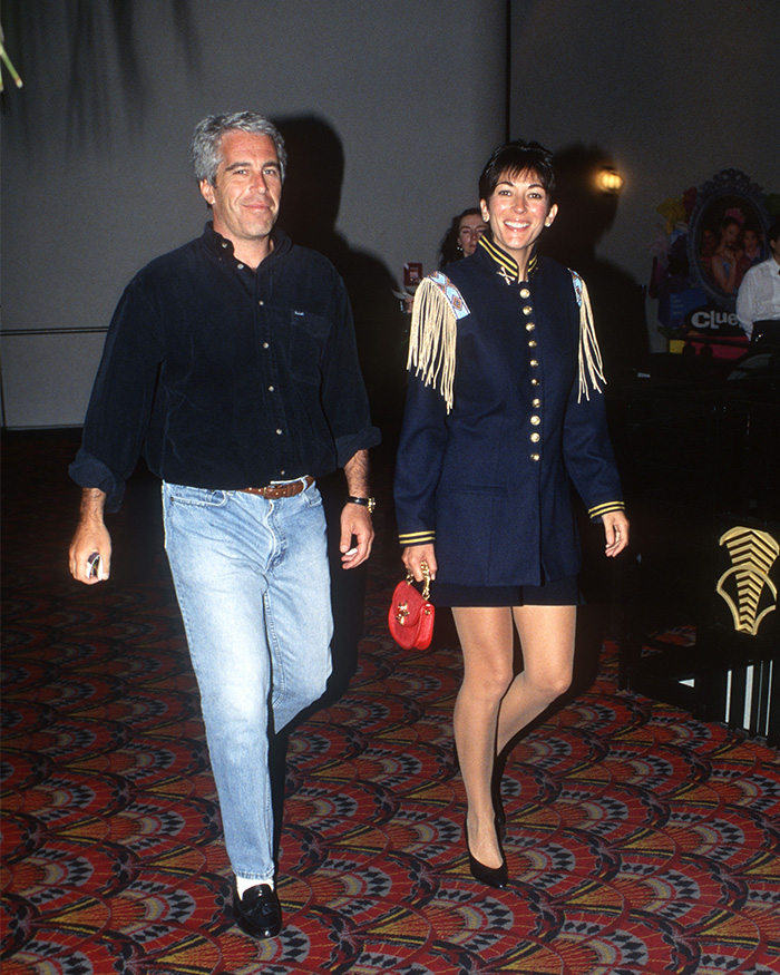 Man and woman walking indoors in casual and formal outfits, related to DOJ releases and Epstein files news. Man and woman walking indoors in casual and formal outfits, related to DOJ releases and Epstein files news.