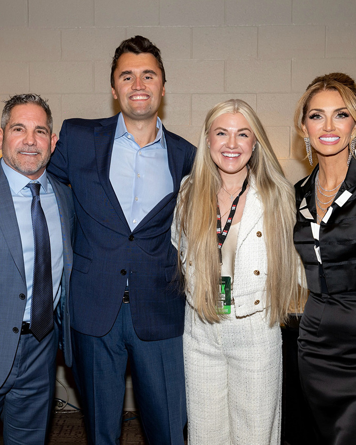Erika Kirk posing with three people, showing her makeup transformation before Charlie's assassination event.