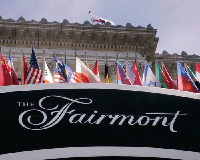 The Fairmont hotel entrance with multiple international flags, related to mystery surrounding Victoria, Tommy Lee Jones&rsquo; daughter.