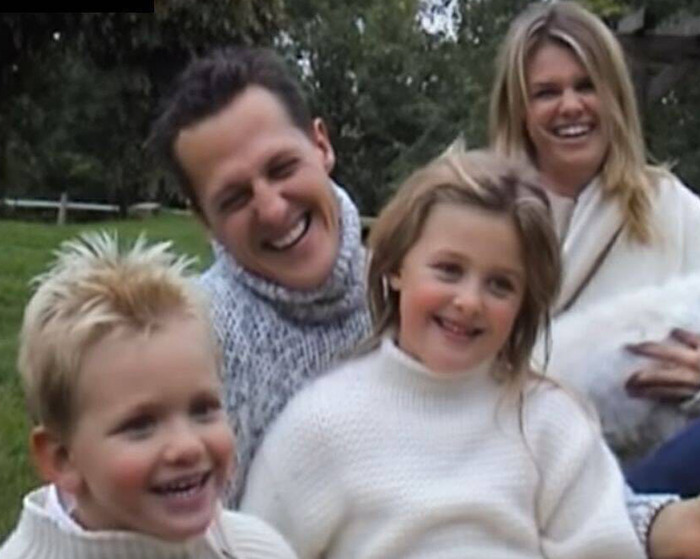 Family photo of Michael Schumacher with two children and a woman outdoors, related to Pierre Gasly backlash tribute.