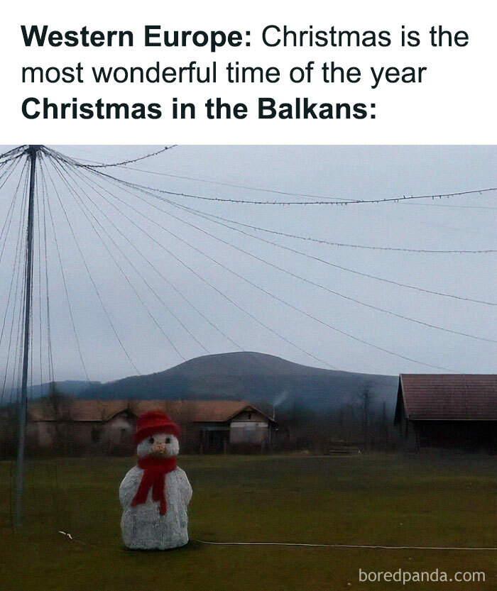 Snowman wearing red scarf and hat in a rural field, illustrating a funny Eastern European experience during Christmas.