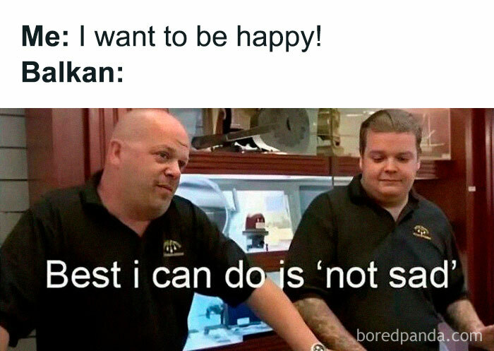 Two men in black shirts showing a funny Eastern European meme about being happy and not sad in the Balkan experience.
