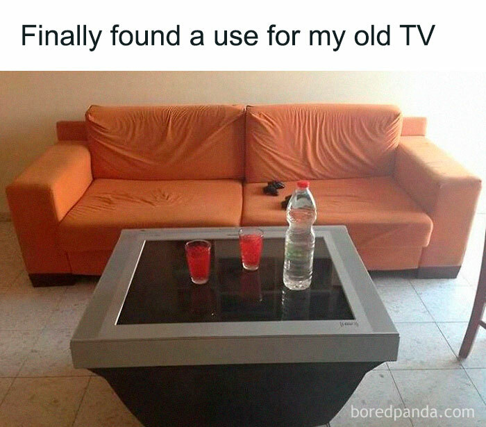 Old TV repurposed as a table in front of couch, capturing the humor of Eastern European funny pics and memes experience.