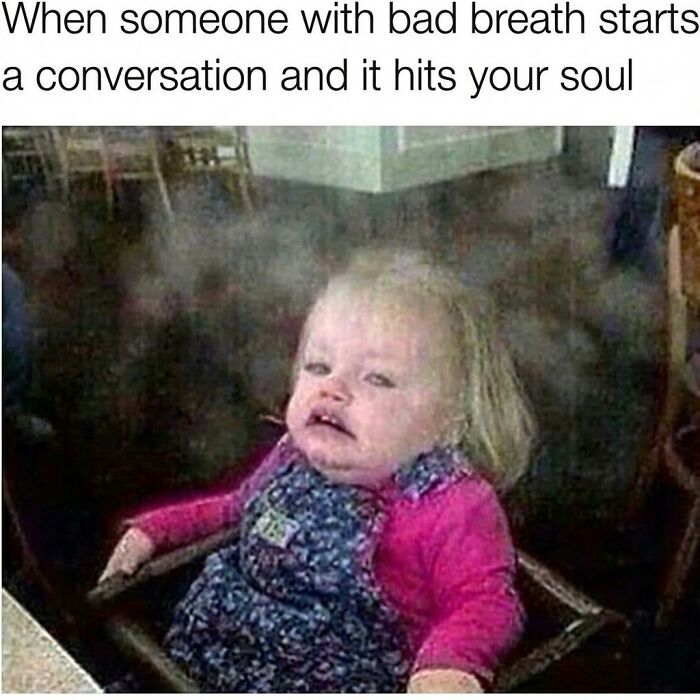 Toddler making a disgusted face as if hit by bad breath, capturing randomness in funny memes that might crack you up.