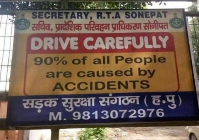 Road safety sign with confusing English text about accidents, illustrating people breaking their brain trying to understand.