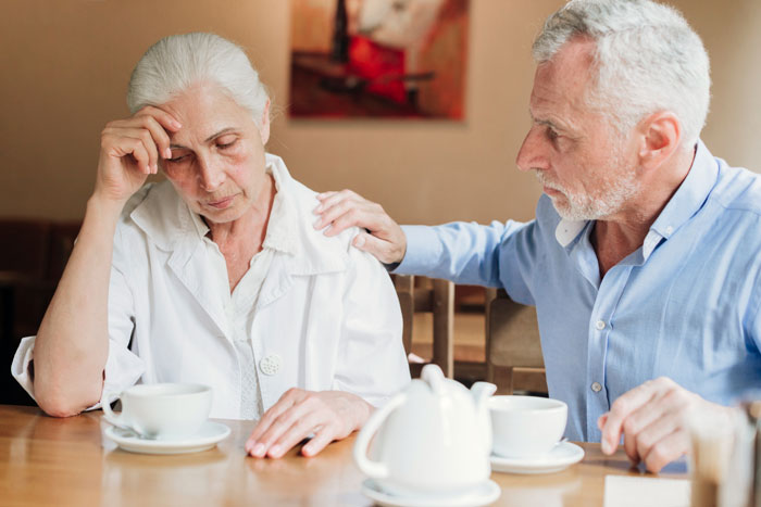 An elderly man comforts a distressed older woman during a tense visit involving suite bedroom and boyfriend&rsquo;s car issues.