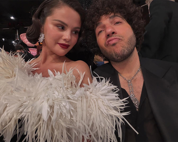 Two stars posing closely at the 2026 Golden Globes amid chaos and controversy involving arrogant behavior and smoking at tables.