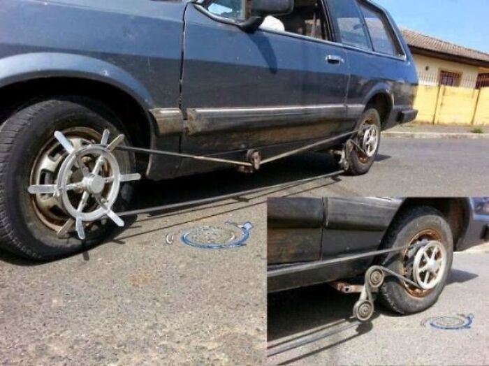 Car locked with a DIY steering wheel wheel lock made from metal rods and steering wheels, showing a failed DIY attempt.