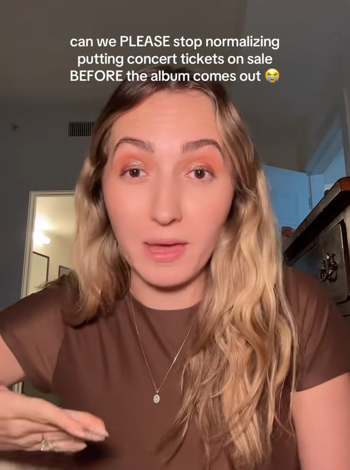 Woman with long blonde hair discussing fan outrage over Harry Styles new tour ticket prices before album release.