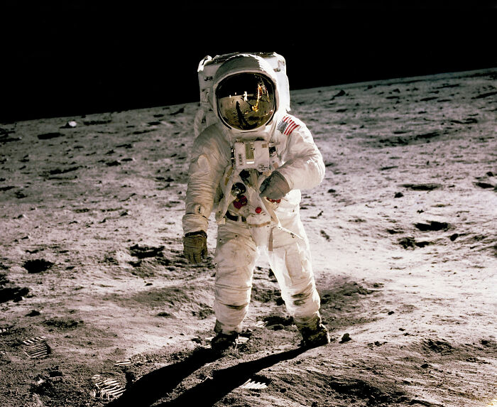 Astronaut on the moon during a historic mission, highlighting moments so ridiculous people thought they were being pranked.