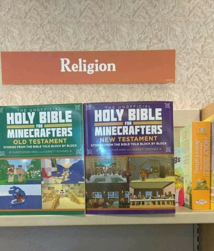 Books titled Holy Bible for Minecrafters on a shelf under a religion sign, illustrating a dystopia in modern culture.