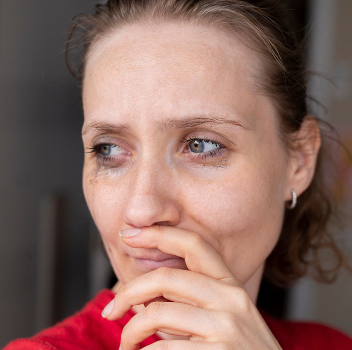 Woman pushed to her limits by stepdaughters&rsquo; gift, showing emotional reaction while reflecting on conversation with husband.
