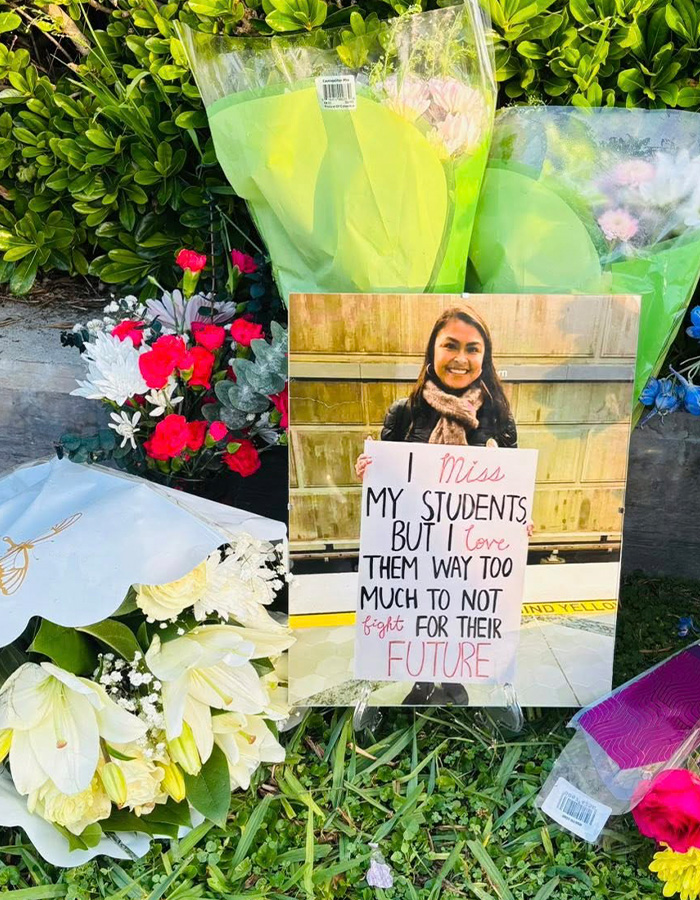 Memorial with flowers and photo of a teacher, highlighting teacher&rsquo;s life and impact after diary discovery of affair.