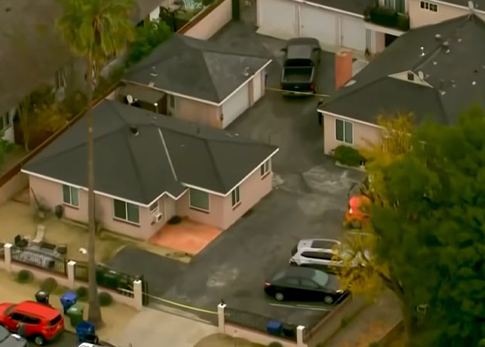 Aerial view of a residential home with police tape after husband uncovers teacher&rsquo;s affair in explosive diary discovery.
