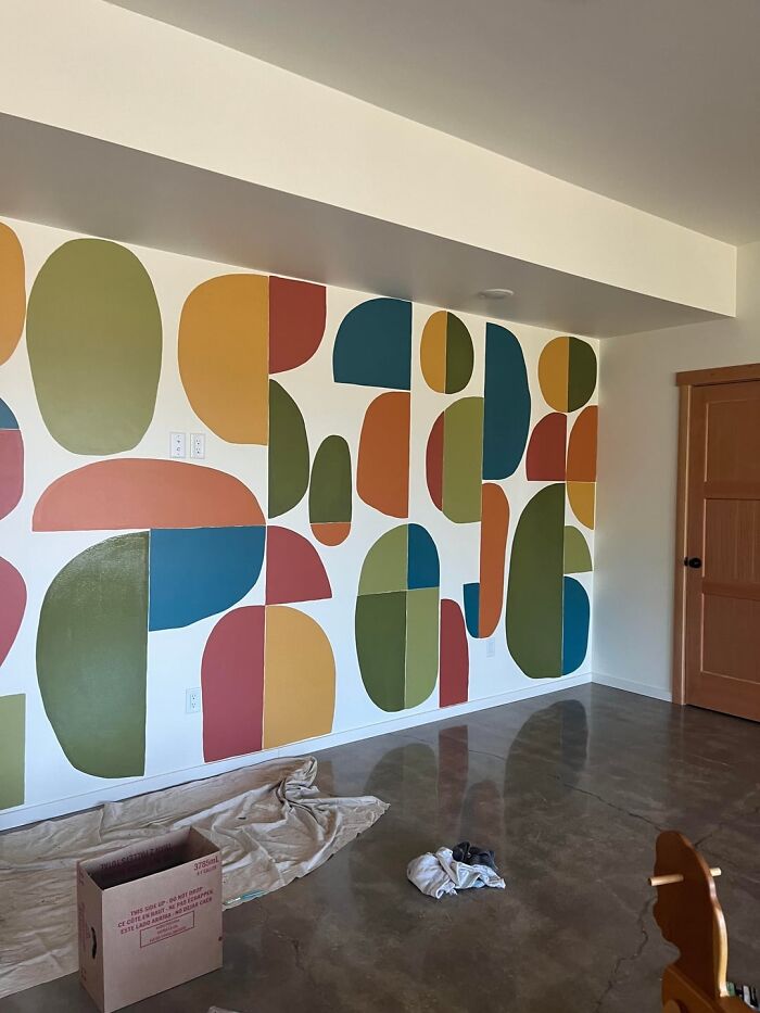 Abstract colorful geometric wall decor in a modern home showcasing creative home decoration ideas.