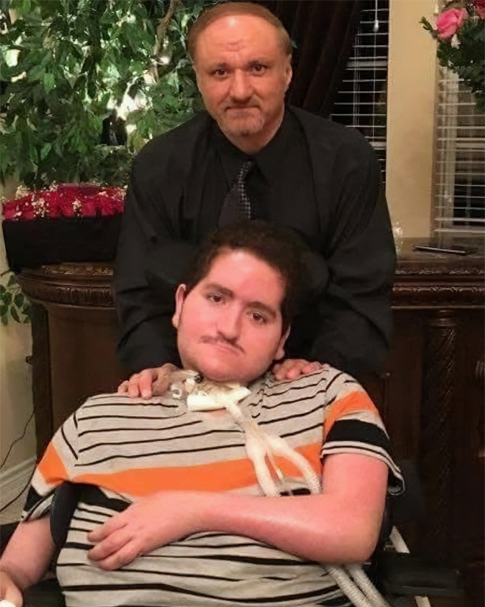 Father and son at home, highlighting detained father's inability to attend son's funeral due to ICE restrictions.