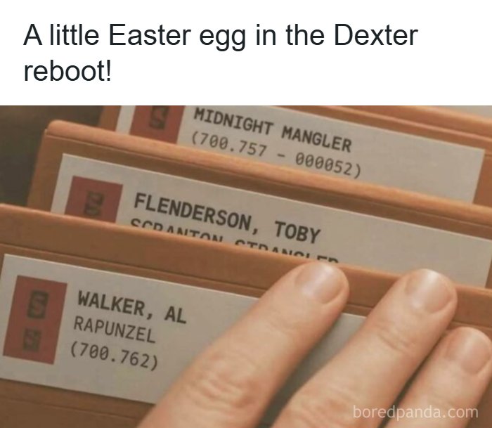 Close-up of a hand flipping through files with names referencing memes inspired by the TV series The Office.