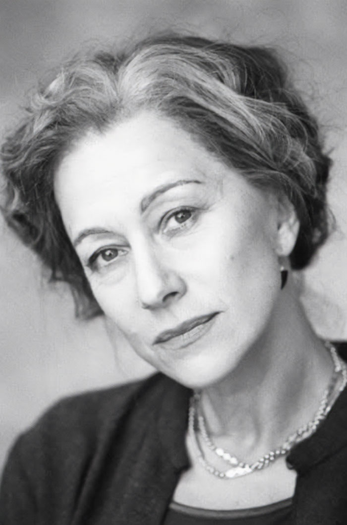 Black and white portrait of an older woman with gray hair, showing a side of history rarely seen in textbooks.