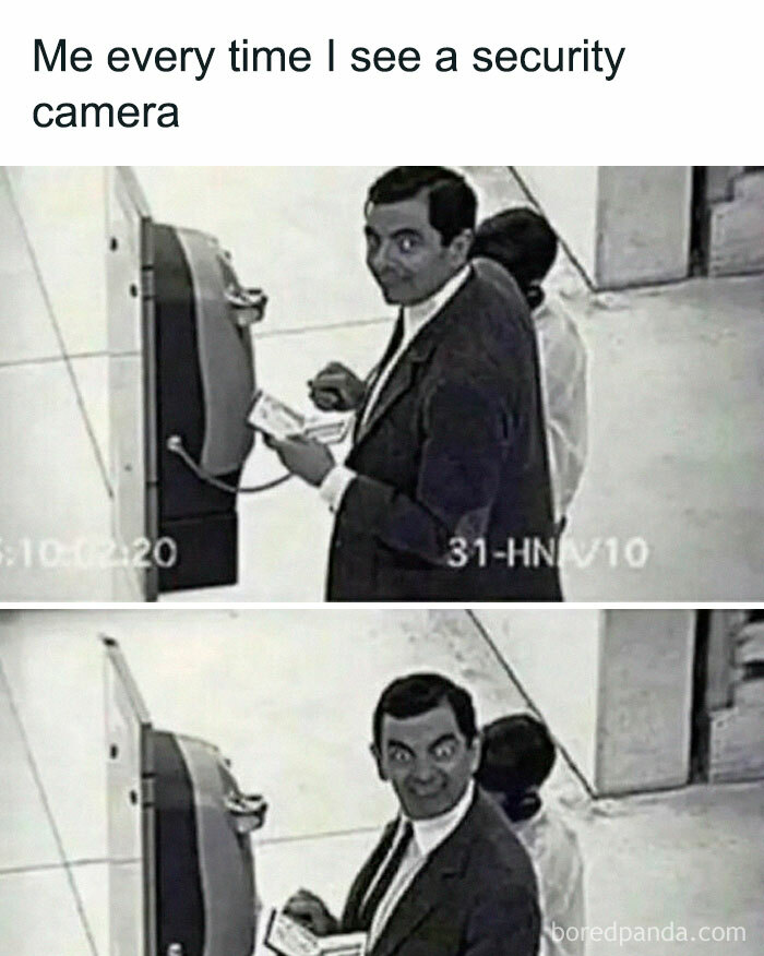 Man making a funny face at a security camera, capturing a relatable introvert moment in a humorous meme.