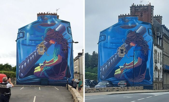 Realistic 3D mural of a girl inside a large blue bottle painted on a dull building wall in an urban setting.