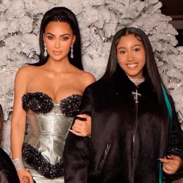 Kim Kardashian with daughter North West at an event, sparking discussions over North West interacting with adults. Kim Kardashian with daughter North West at an event, sparking discussions over North West interacting with adults.