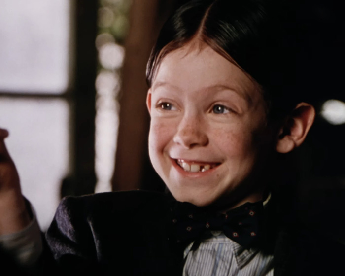 Young Little Rascals star smiling in formal attire, linked to living off the grid and Catholic extremist lifestyle. Young Little Rascals star smiling in formal attire, linked to living off the grid and Catholic extremist lifestyle.