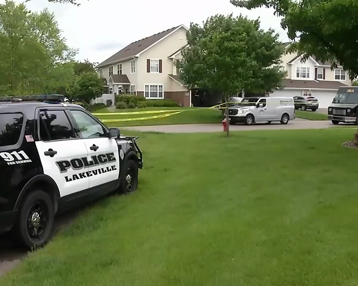 Police vehicles and crime scene tape outside a suburban house linked to pregnant sister&rsquo;s homicide investigation.
