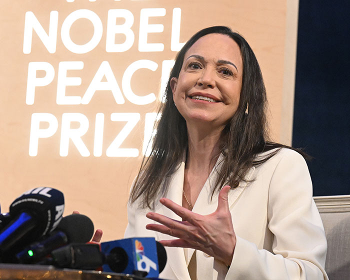 Peace Prize recipient speaking at a press conference amid discussions of gifting her Nobel medal to Trump.