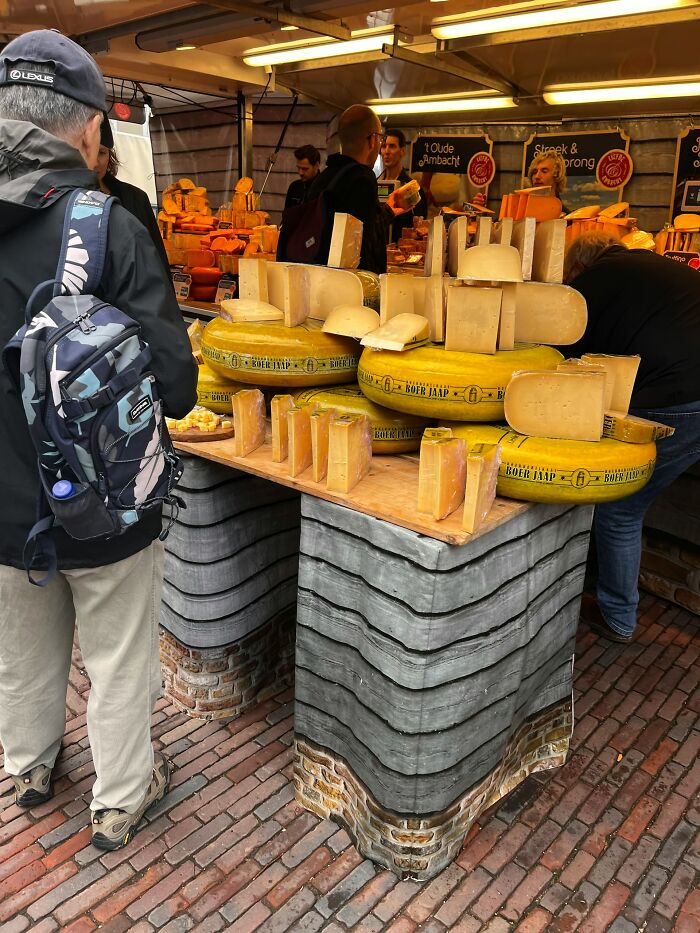 Night shift workers experiencing 3 AM chaos at a busy cheese market during an intense night shift.