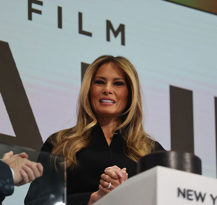 Melania Trump speaking at a film event, highlighted in viral images about her new documentary’s humiliating truth.